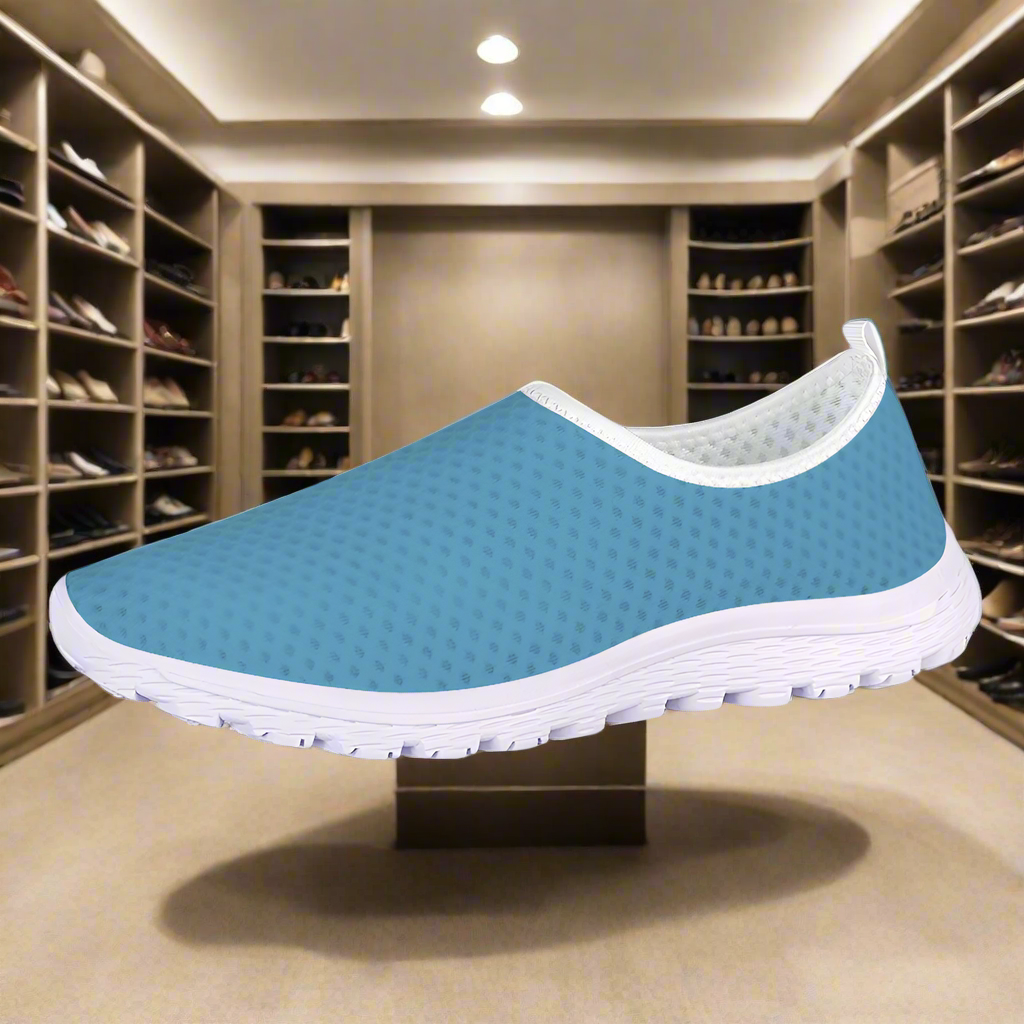 Introducing the "Not Here To Play Nice Cushion Kicks," a slip-on sneaker in sky blue with a white sole, designed with a breathable mesh upper and slip-resistant grip.