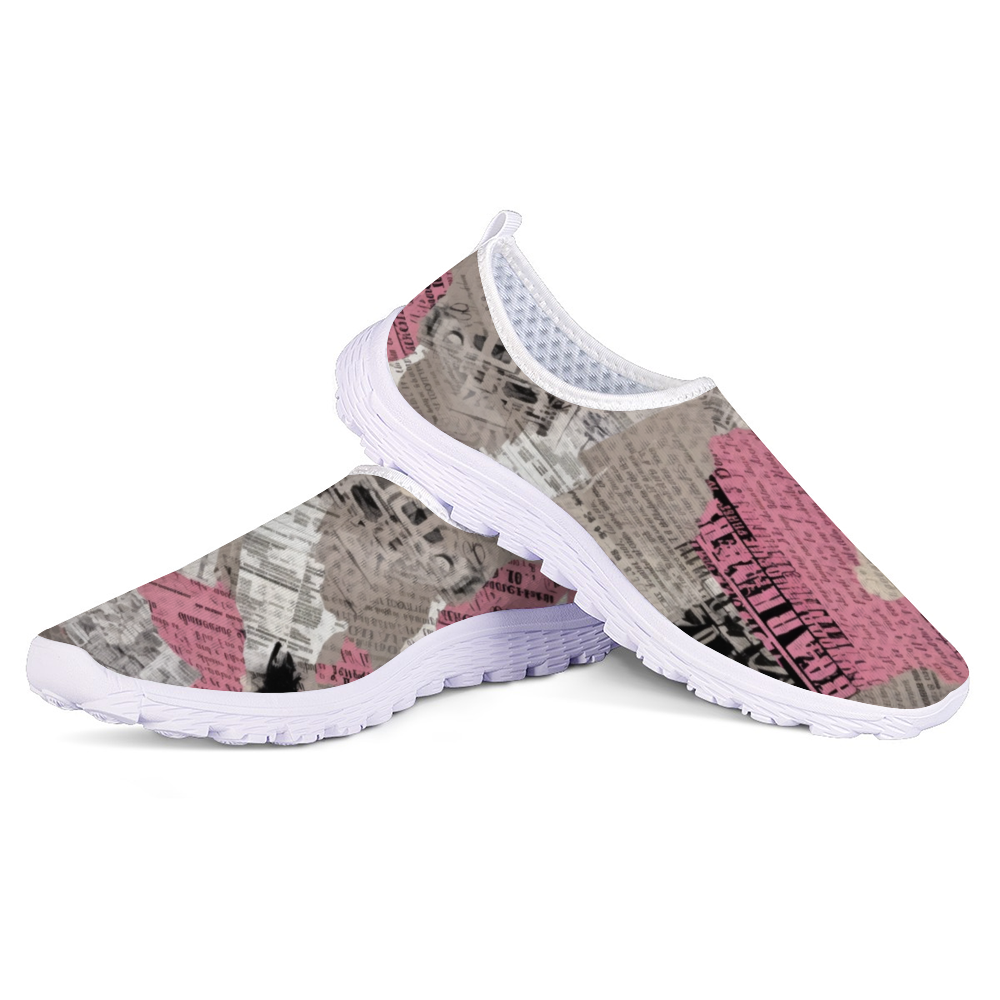 A lightweight slip-on sneaker featuring a pattern of torn newspaper articles in various shades of pink, black, and gray. Made with breathable mesh fabric for added comfort and style, the Pretty Confidential Non-Slip Lightweight Sneakers are perfect for any casual outing.