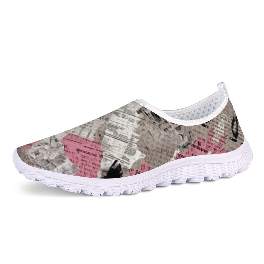 A lightweight slip-on sneaker featuring a pattern of torn newspaper articles in various shades of pink, black, and gray. Made with breathable mesh fabric for added comfort and style, the Pretty Confidential Non-Slip Lightweight Sneakers are perfect for any casual outing.