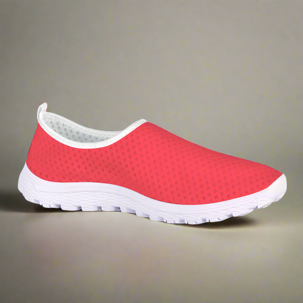 The Unstoppable Hustle Kushion Kicks feature a single red slip-on design with a white sole and mesh fabric, angled slightly to the side, ideal for fans of athletic sport shoes.