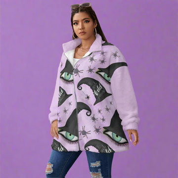 Person wearing a purple coat with cat eye and witch hat pattern on a white background