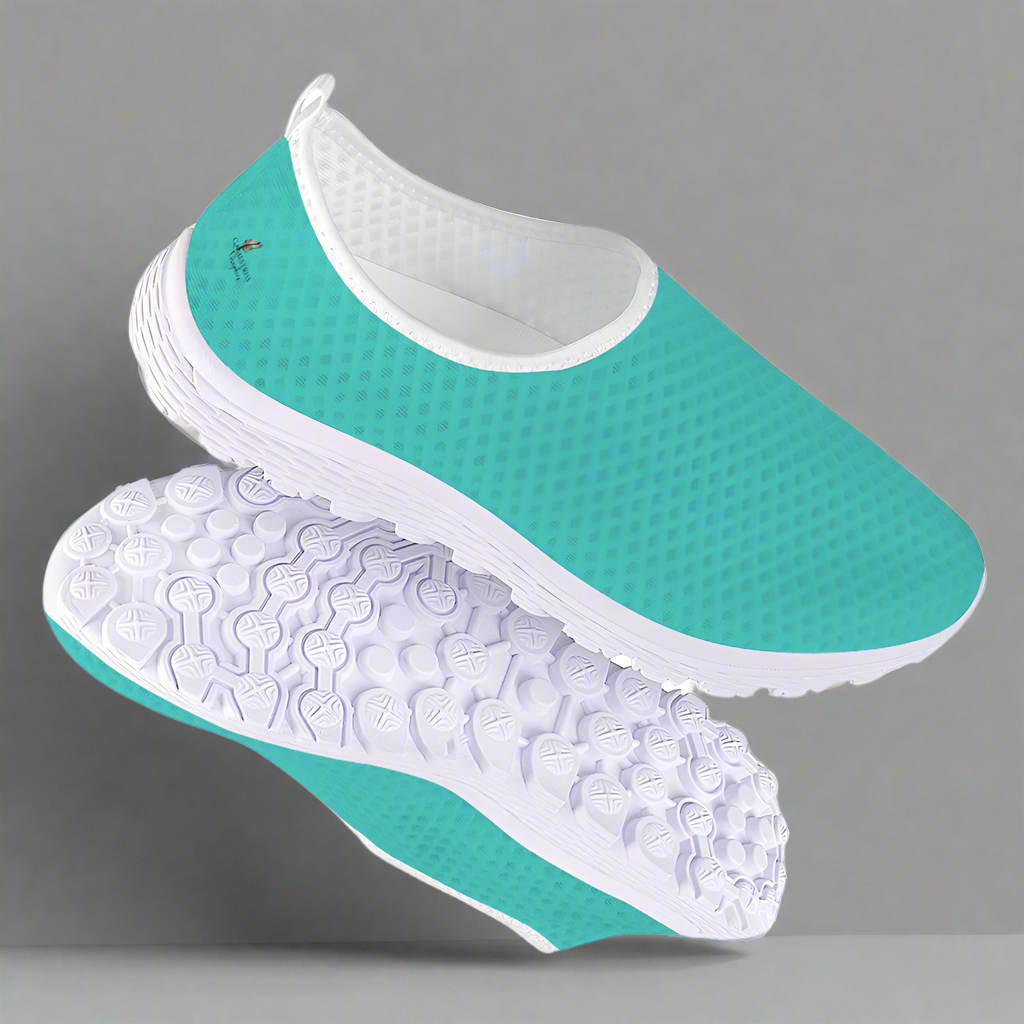 The She's a Vibe 40 Cushion Kicks in teal showcases a breathable mesh upper and a sleek white sole, blending comfort with style.
