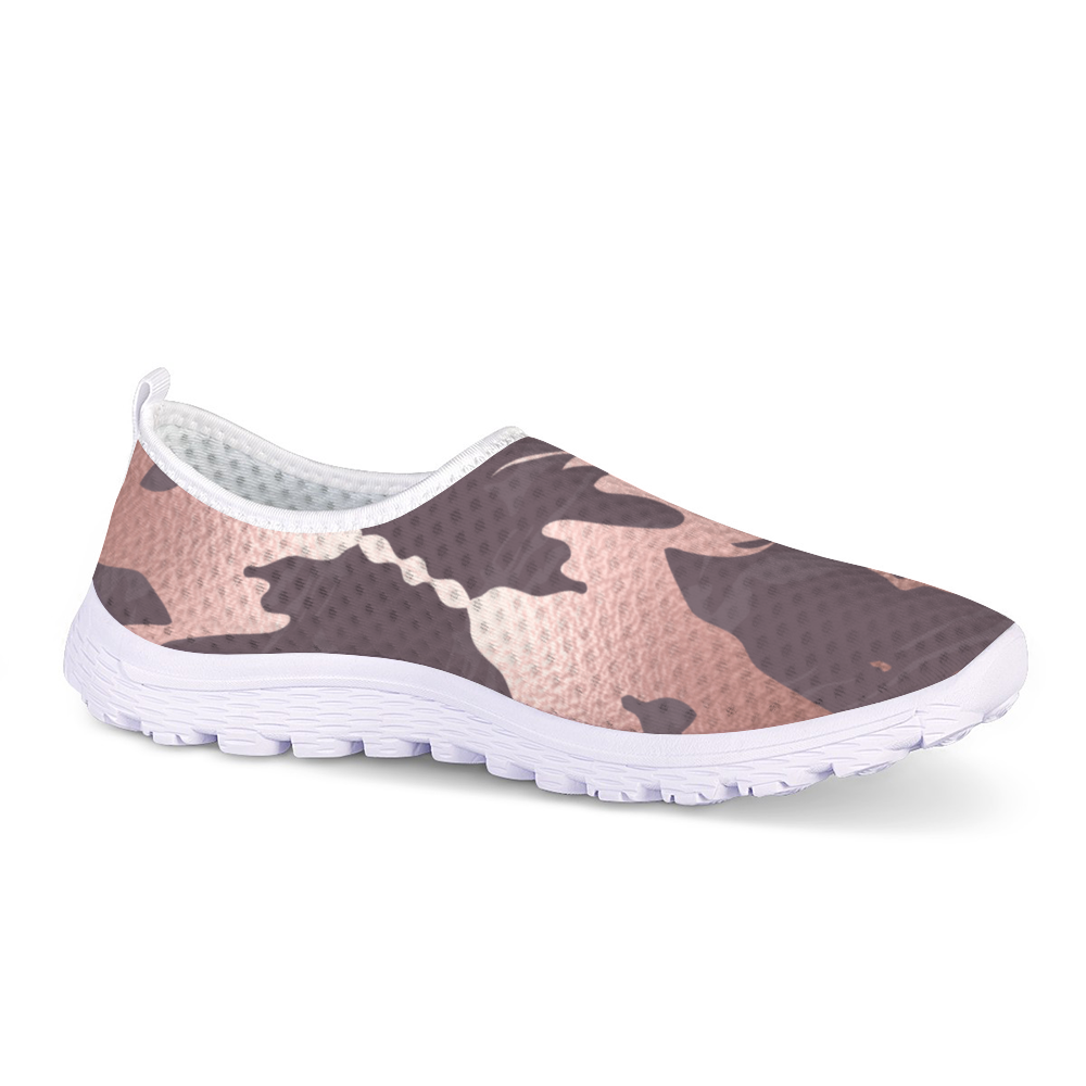 The Fall Flow Cushion Kicks are slip-on athletic shoes with a white sole and a camouflage pattern in pink, brown, and gray tones, featuring breathable mesh for maximum comfort.