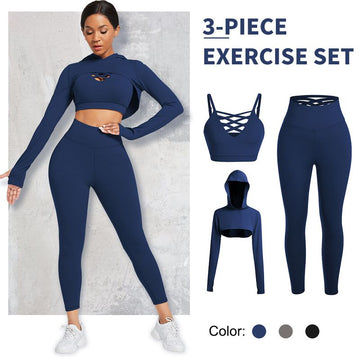 A woman is showcasing the Gamestriss Hooded Crossover Underwear Yoga Suit in navy, featuring a 3-piece ensemble that includes a strappy sports bra, cropped hoodie, and leggings. The slim-fit design is available in navy, gray, and black, offering style with a comfortable waistband for maximum ease.