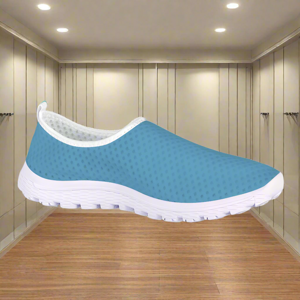 Introducing the "Not Here To Play Nice Cushion Kicks," a slip-on sneaker in sky blue with a white sole, designed with a breathable mesh upper and slip-resistant grip.