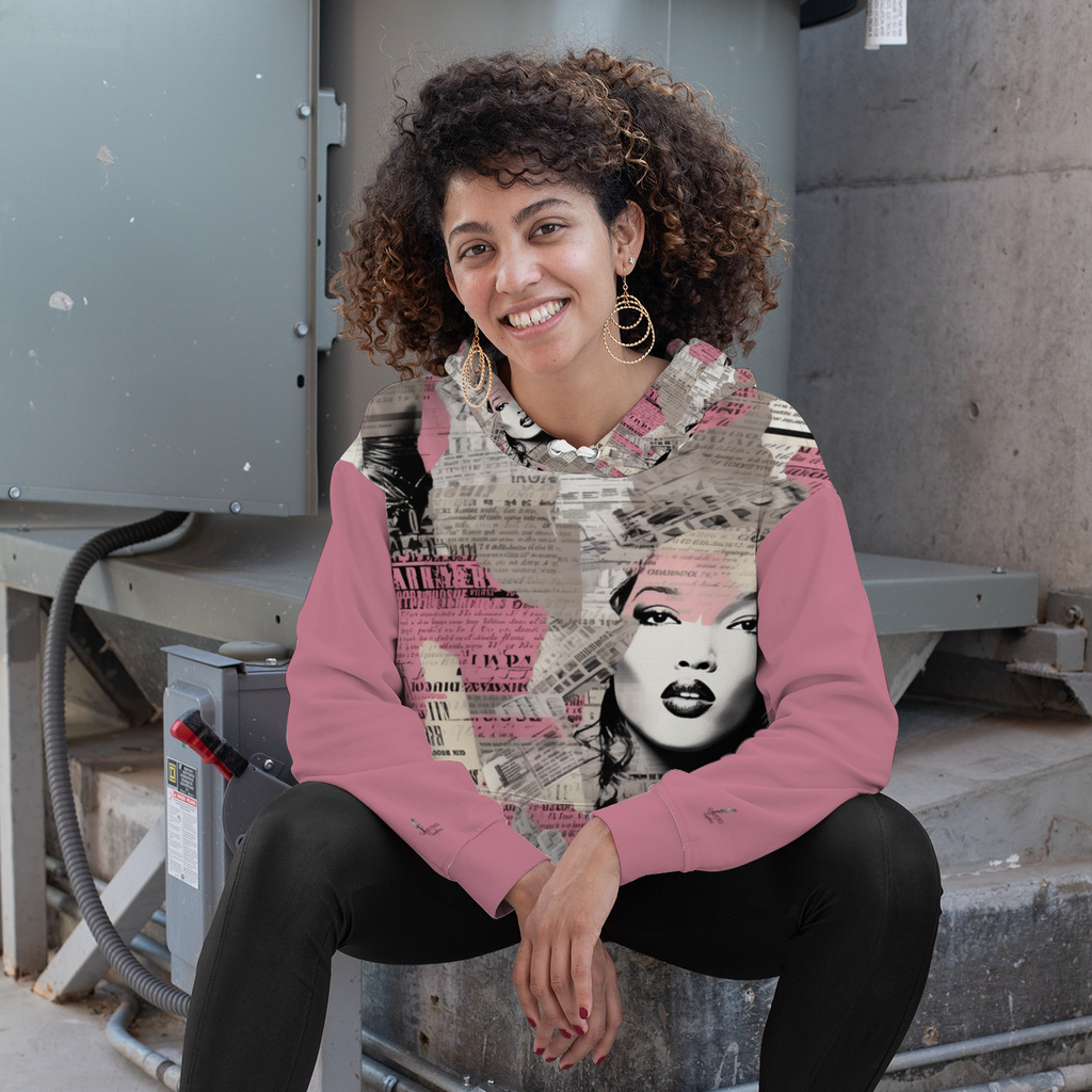 A Pretty Confidential Plush Hoodie with Pockets with pink sleeves and a collage-style design on the body featuring newspaper clippings and a woman's face, perfect for casual style while staying warm and soft.