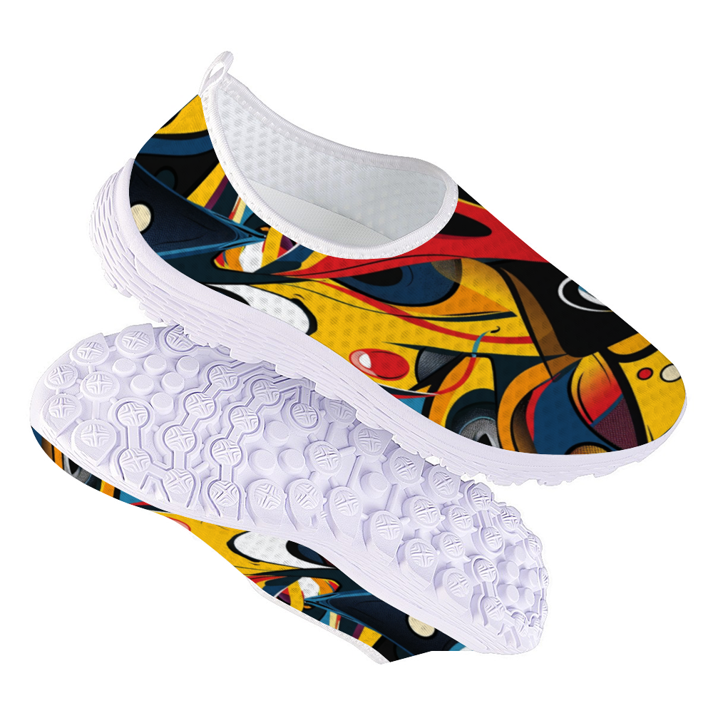 Funky Femme Cushion Kicks are stylish white slip-on walking shoes adorned with a colorful, abstract design featuring vibrant red, yellow, blue, and black shapes. Perfect for daily wear, these trendy sneakers offer slip-resistant soles for enhanced safety and comfort.