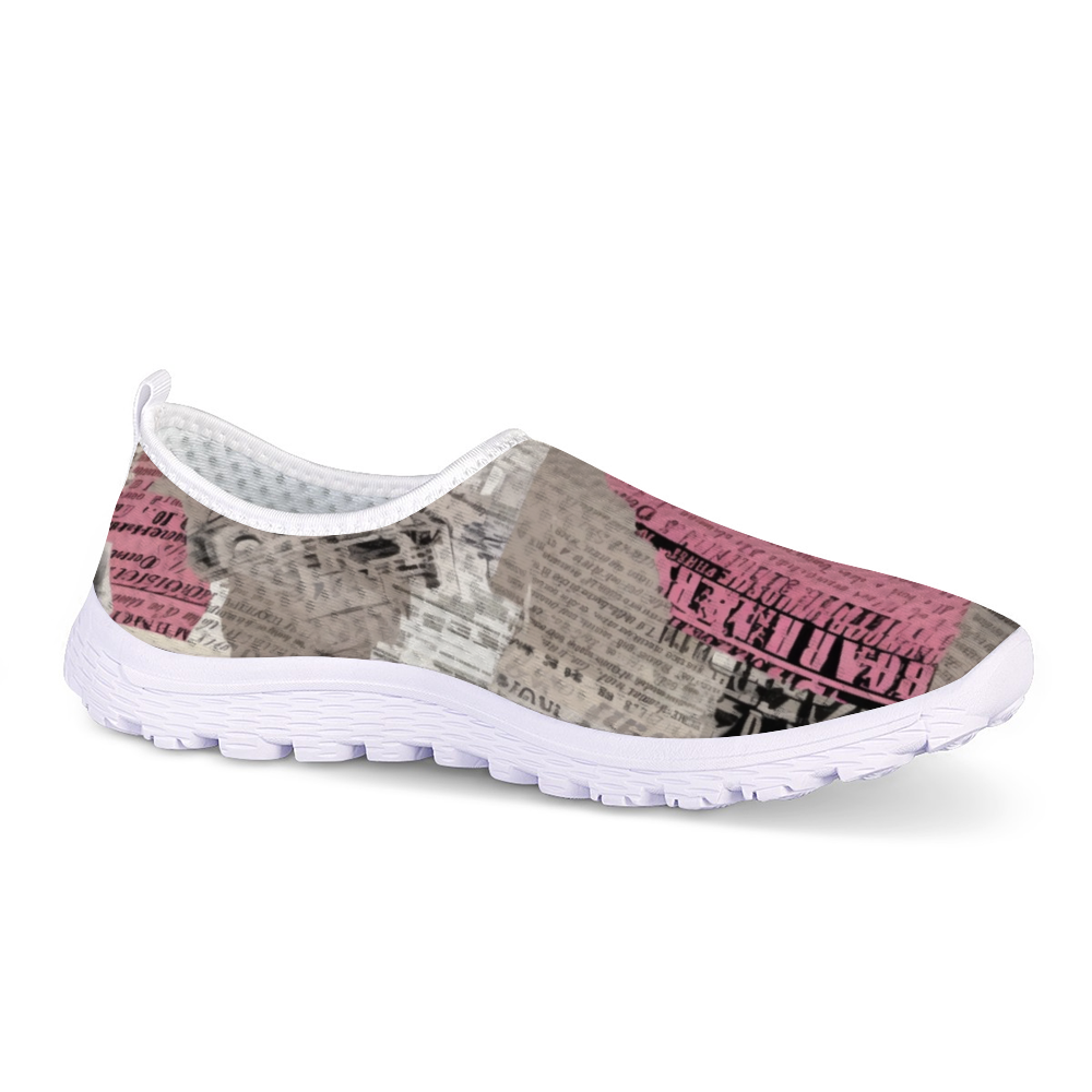 A lightweight slip-on sneaker featuring a pattern of torn newspaper articles in various shades of pink, black, and gray. Made with breathable mesh fabric for added comfort and style, the Pretty Confidential Non-Slip Lightweight Sneakers are perfect for any casual outing.