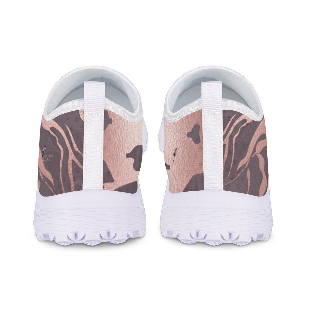 The Fall Flow Cushion Kicks are slip-on athletic shoes with a white sole and a camouflage pattern in pink, brown, and gray tones, featuring breathable mesh for maximum comfort.