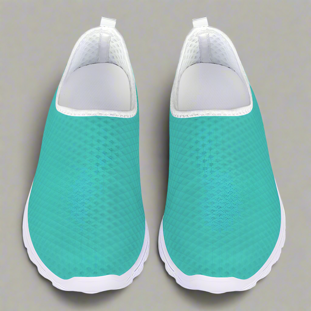 The She's a Vibe 40 Cushion Kicks in teal showcases a breathable mesh upper and a sleek white sole, blending comfort with style.