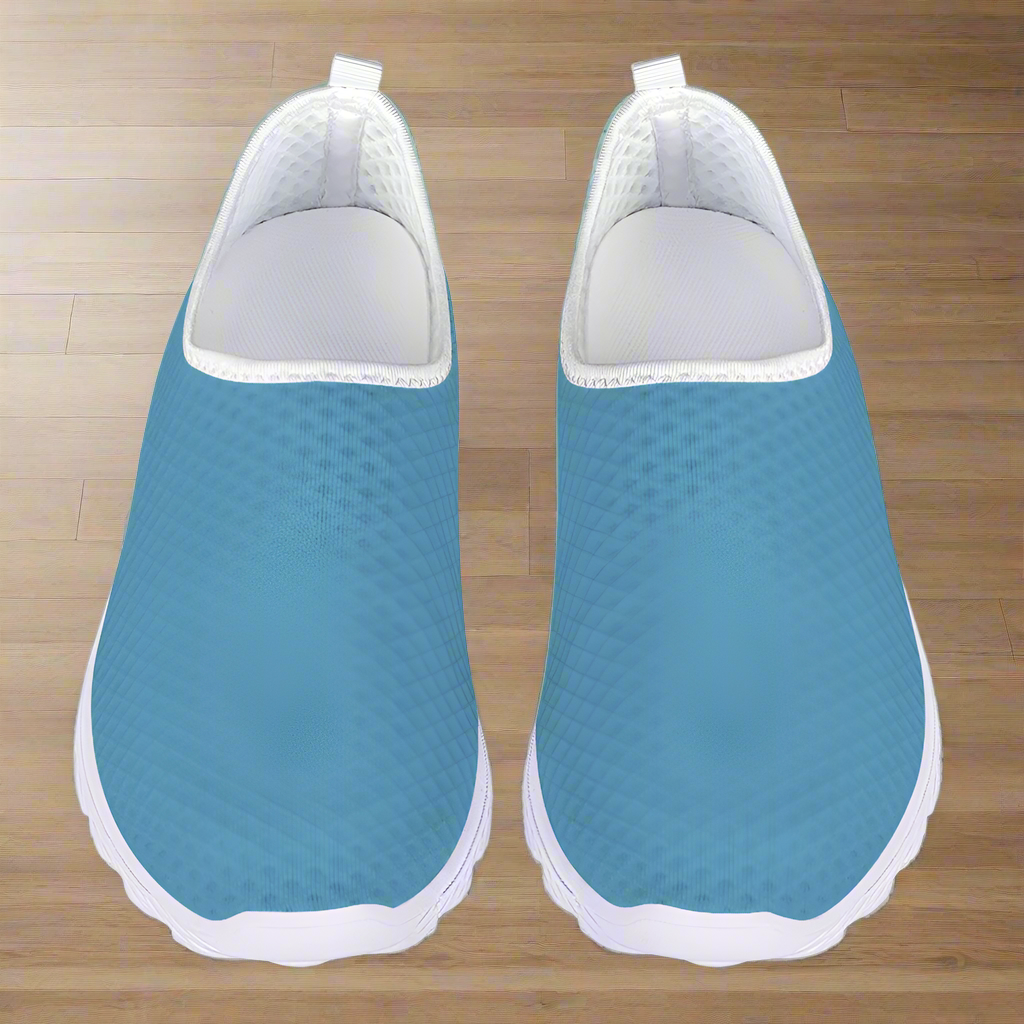 Introducing the "Not Here To Play Nice Cushion Kicks," a slip-on sneaker in sky blue with a white sole, designed with a breathable mesh upper and slip-resistant grip.