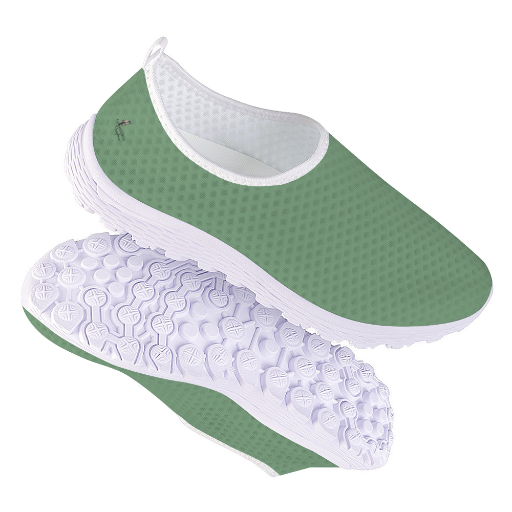 The Sunny Sophistication Cushion Kicks are green slip-on sneakers with a white sole and mesh fabric design, ideal walking shoes due to their slip-resistant features.