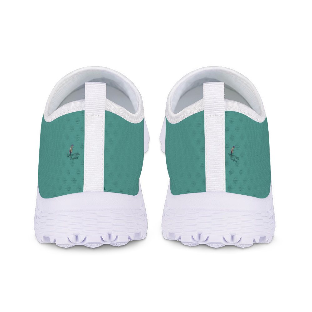 The Next Level Cushion Kicks, featuring a teal slip-on design with a textured mesh upper and white sole, are stylishly showcased against a pristine white background.