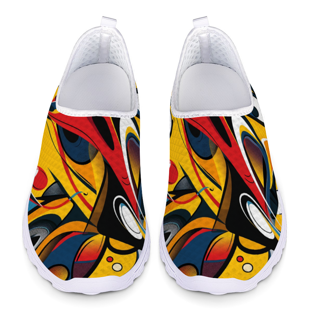 Funky Femme Cushion Kicks are stylish white slip-on walking shoes adorned with a colorful, abstract design featuring vibrant red, yellow, blue, and black shapes. Perfect for daily wear, these trendy sneakers offer slip-resistant soles for enhanced safety and comfort.