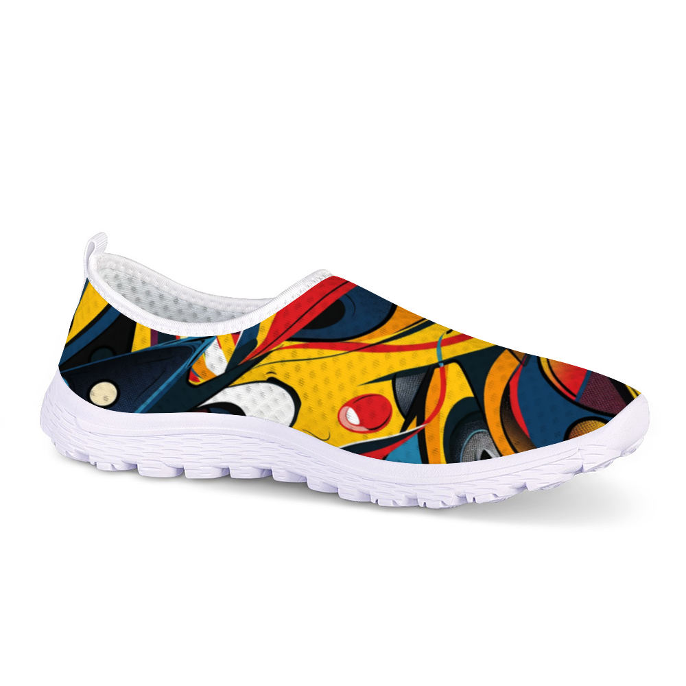 Funky Femme Cushion Kicks are stylish white slip-on walking shoes adorned with a colorful, abstract design featuring vibrant red, yellow, blue, and black shapes. Perfect for daily wear, these trendy sneakers offer slip-resistant soles for enhanced safety and comfort.