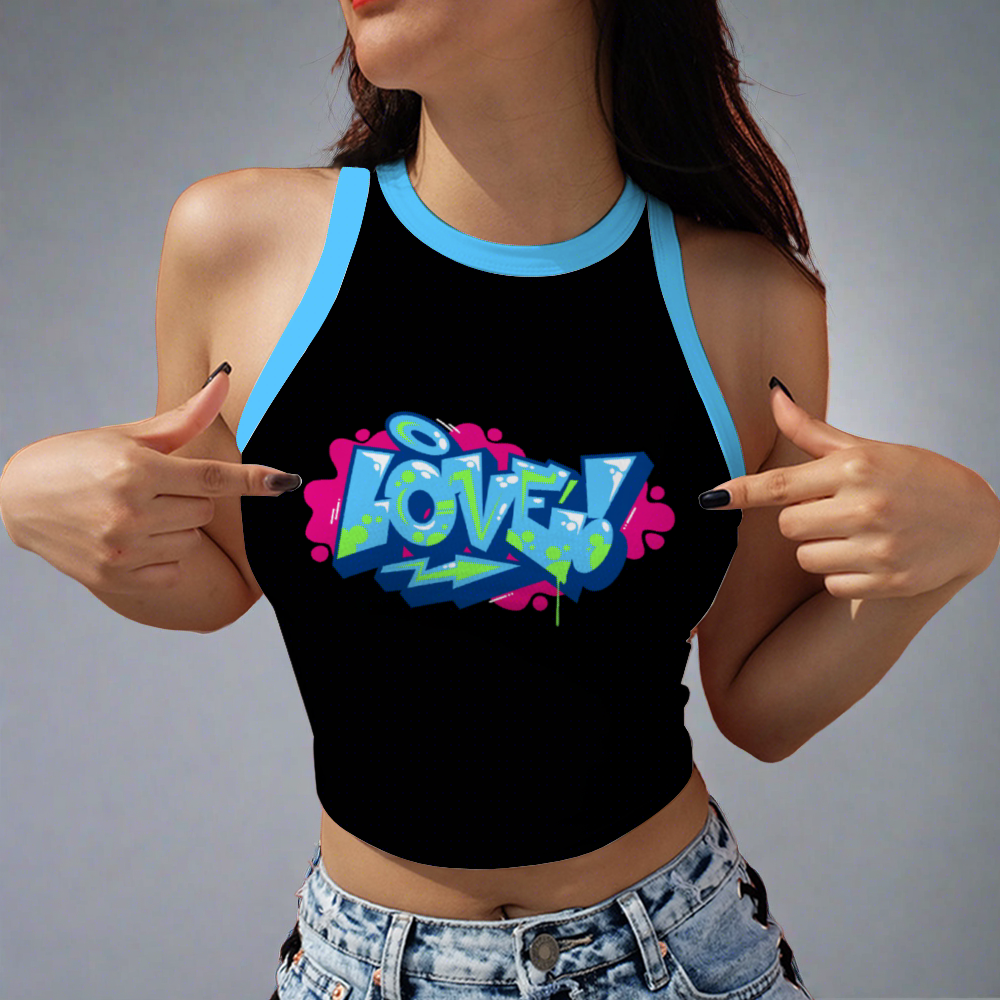 Woman in a Love Women's Sleeveless Cropped Tank Top with a graffiti-style "love!" print pointing at the design.