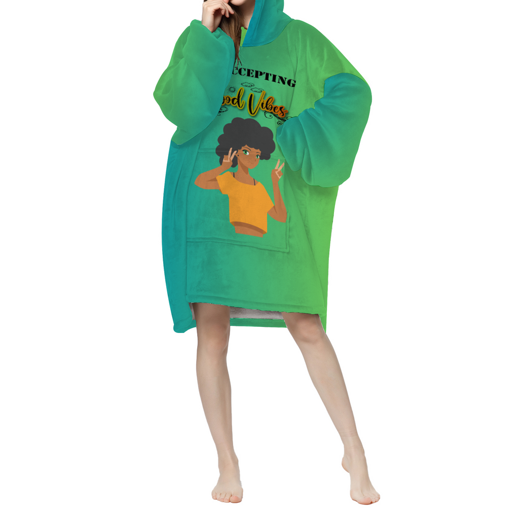 A woman wearing the Now Accepting Good Vibes Green Adult Long Sherpa Hooded Blanket.